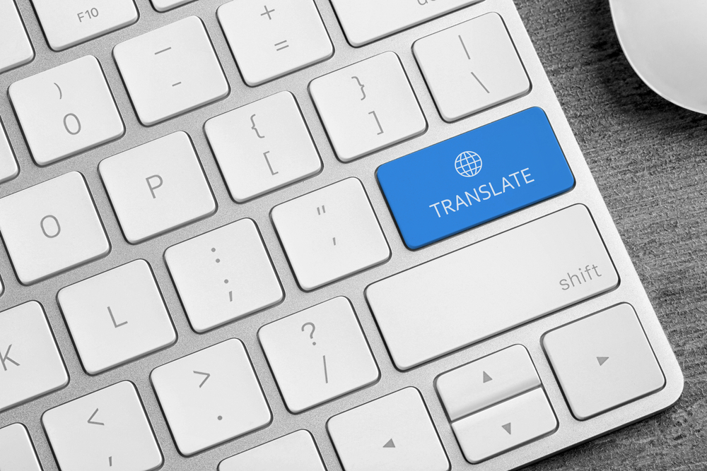 A keyboard with a blue key labelled Translate under a globe icon